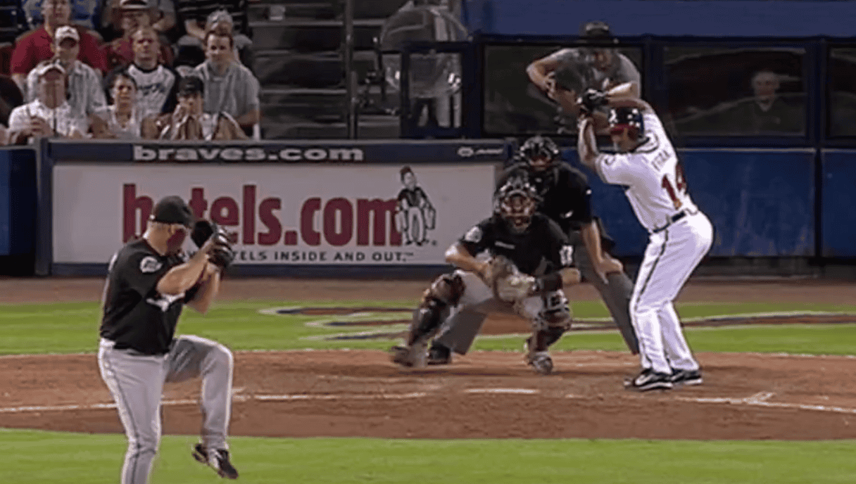 Julio Franco's unique batting stance, illustrating unconventional form in baseball.